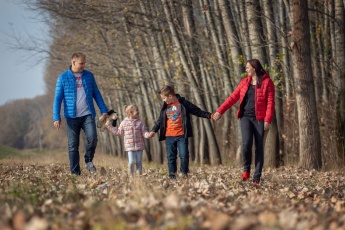Family photo in a countryside forest in Hungary