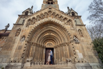 Engaged couple in front of a chapel in Hungary