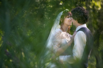 Bride and Groom Cuddling in a Forest in Lower-Austria