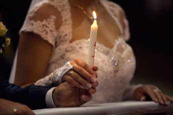 Candle in Bride and Groom Hand