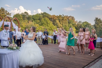 Bride's bouquet toss in Hungary