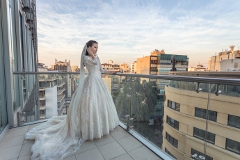 Bride on the balcony of Staybride Suites Hotel in Beirut