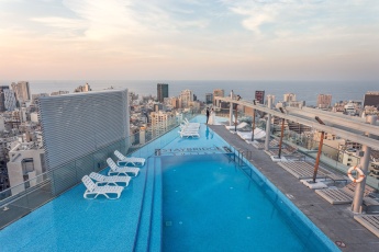 Wedding couple standing on top of a luxury hotel in Beirut, Lebanon