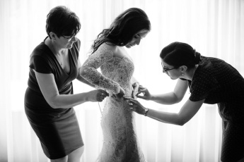 Bride and her mother and sister getting ready