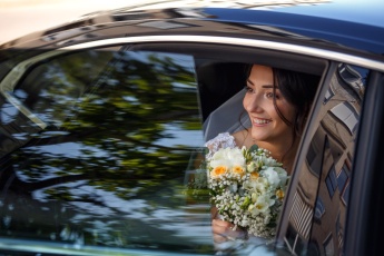 Bride in wedding car in Hungary