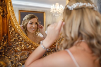 Bride in the mirror during getting ready